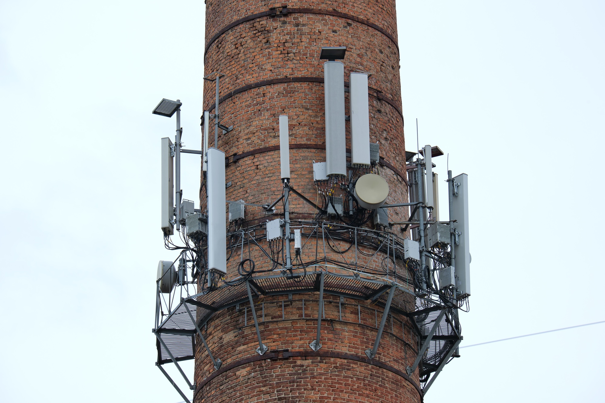 Closeup and detailed view of various GPS, cellphone, 3G, 4G and 5G equipped telecommunication tower