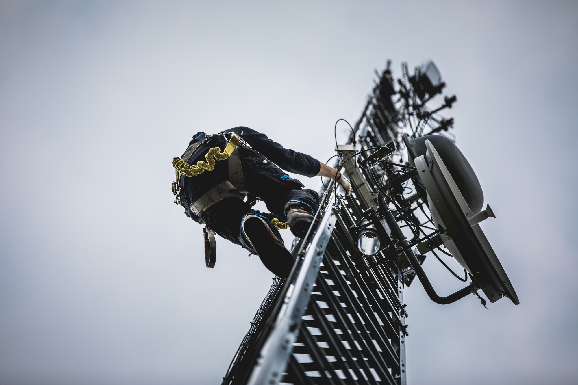 Telecom Worker Climbing Antenna Tower